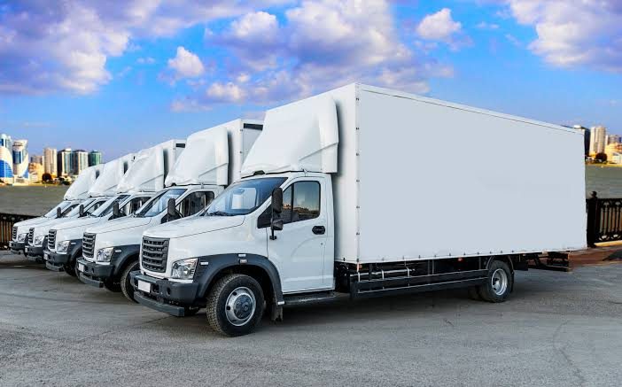 Fleet of white box trucks ready for freight delivery in Dallas-Fort Worth